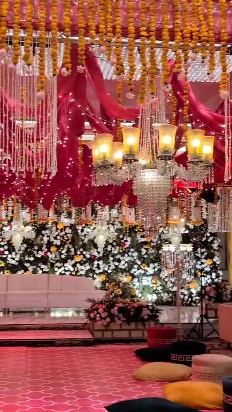 Hanging strands and marigolds for a Mehndi ceiling.
