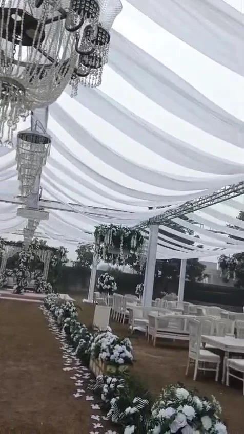 Outdoor Nikkah under string lights and a floral canopy.